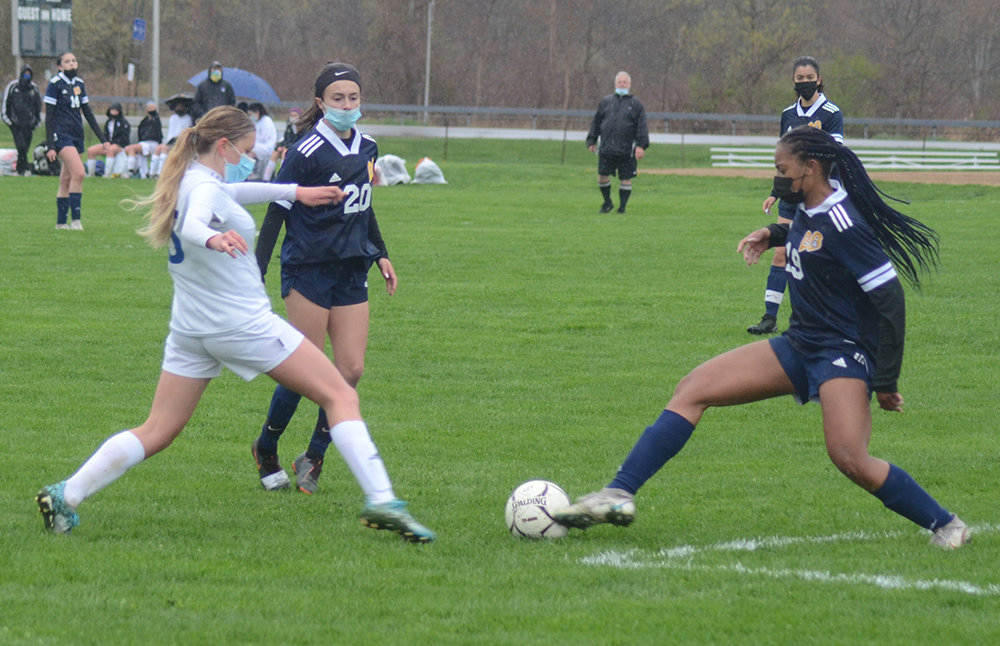 Pine Bush’s Kymorah Boddie (19) tries to clear the ball out.